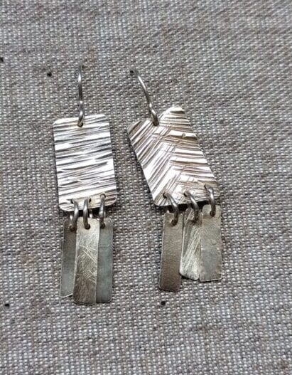 plata quadrats rectangles textura arracades ganxo